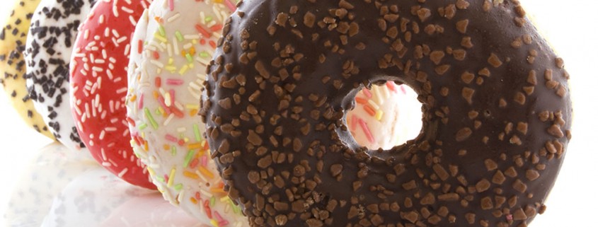 several donuts on a white background