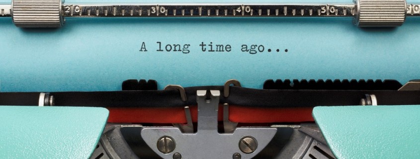 Vintage Typewriter With Phrase "A long time ago..." Typed in Blue Paper